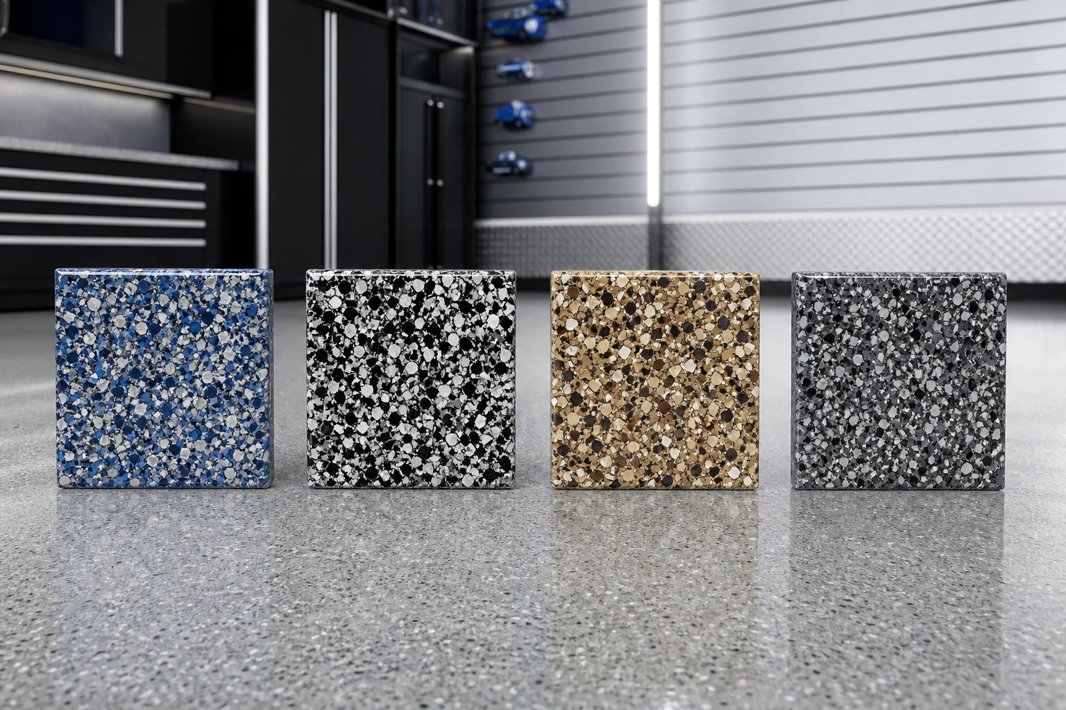 Four square flake epoxy sample tiles in a row showing blue-grey-white, black-and-white, warm earth tone and charcoal-silver blends